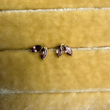 Tura Sugden Mauve Sapphire Earrings, leaf design, recycled 18k gold on yellow velvet.