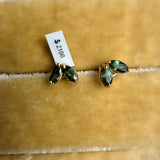 Green Sapphire Earrings by Tura Sugden: recycled 18k gold, 3 sapphires, on yellow velvet.
