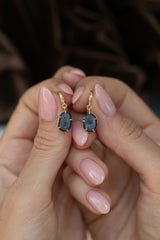 Geode earrings in hands